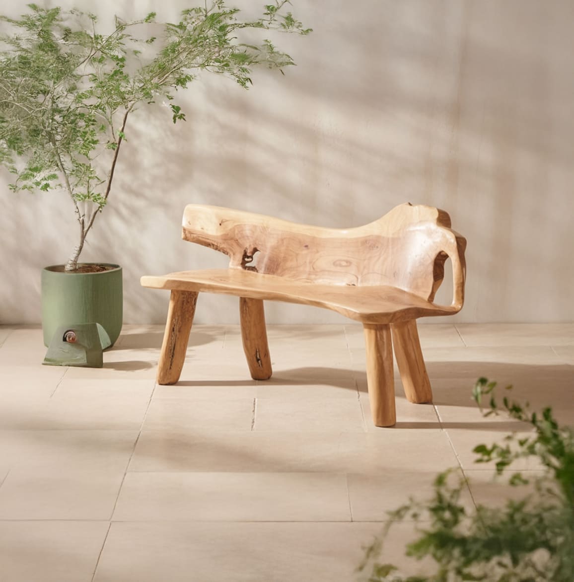 Rustic solid wood live edge garden bench in a cozy outdoor patio setting