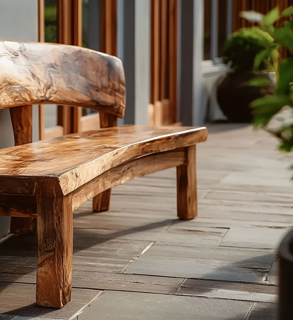 Solid wood outdoor bench featuring natural live edge details and a full-length backrest