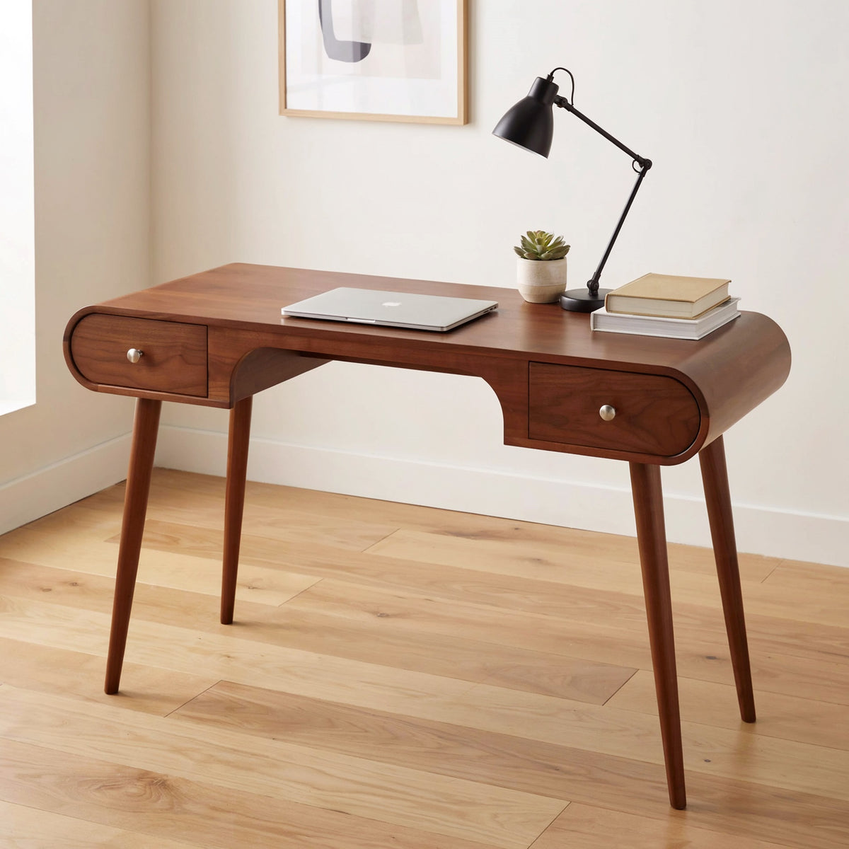 Modern sculptural desk crafted from premium solid wood with curved edges