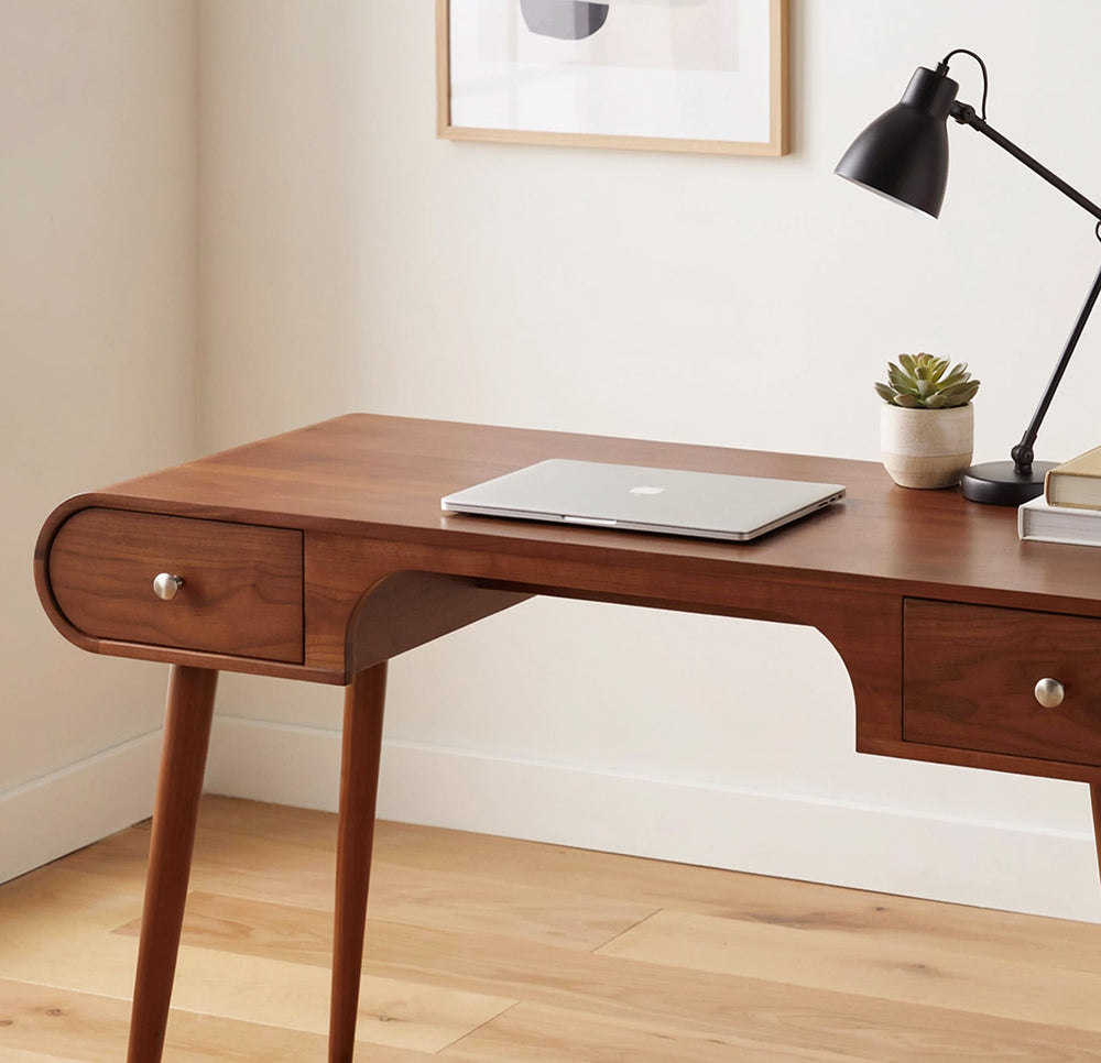 Solid wood writing desk featuring organic curved lines and built-in drawers