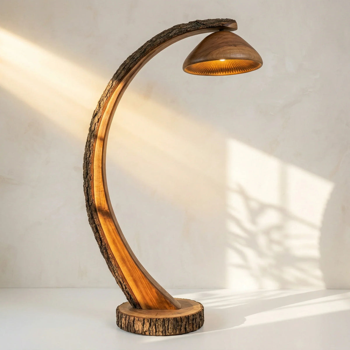 Curved wooden floor lamp with bark-on log stem and mushroom-shaped shade, natural finish
