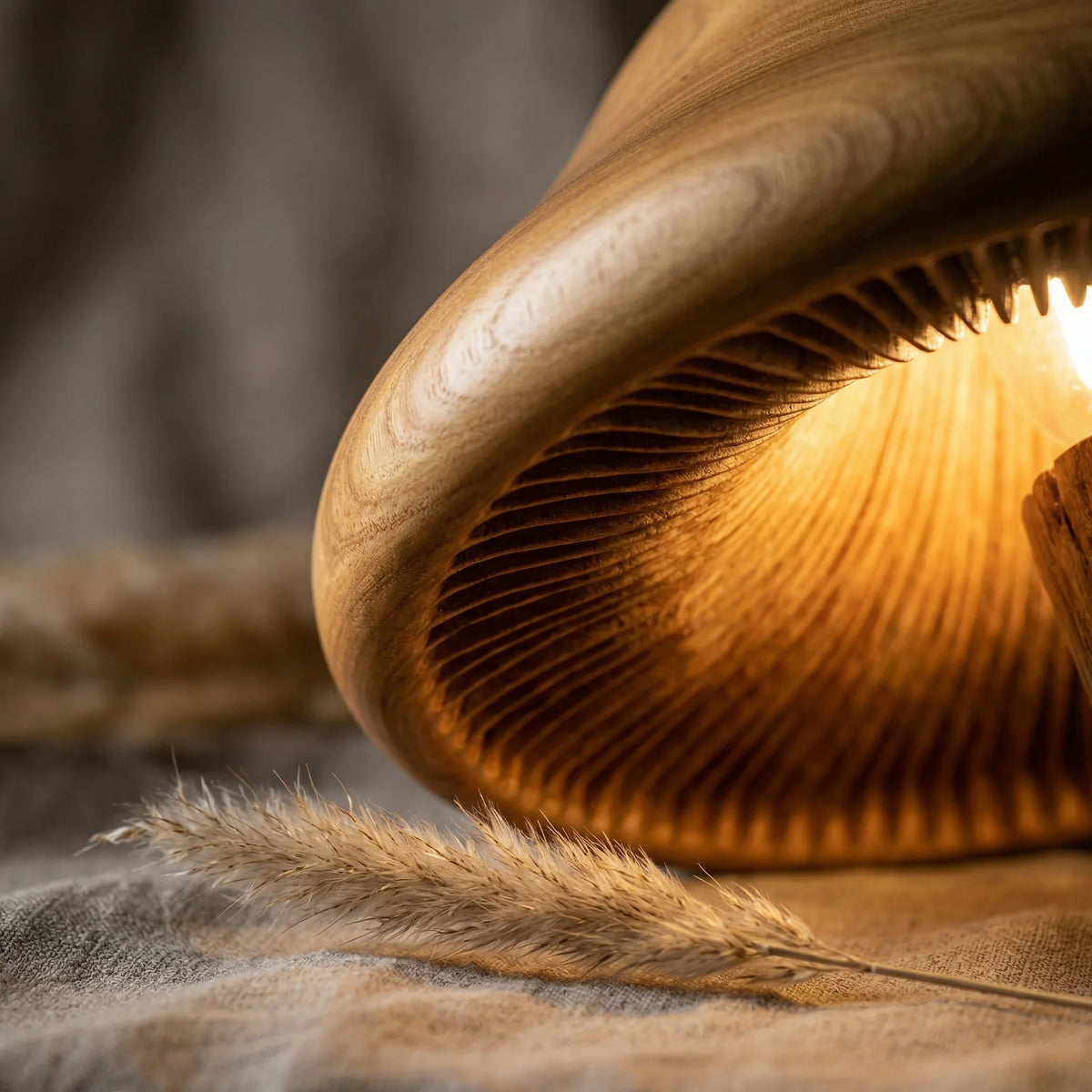 Hand-carved wooden mushroom lamp with illuminated gills and natural textures