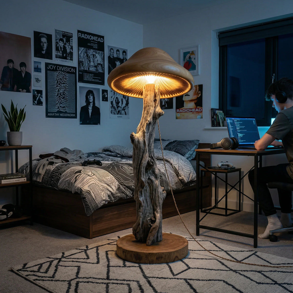 Mushroom-shaped floor lamp with natural wood trunk and glowing carved cap in cozy bedroom.