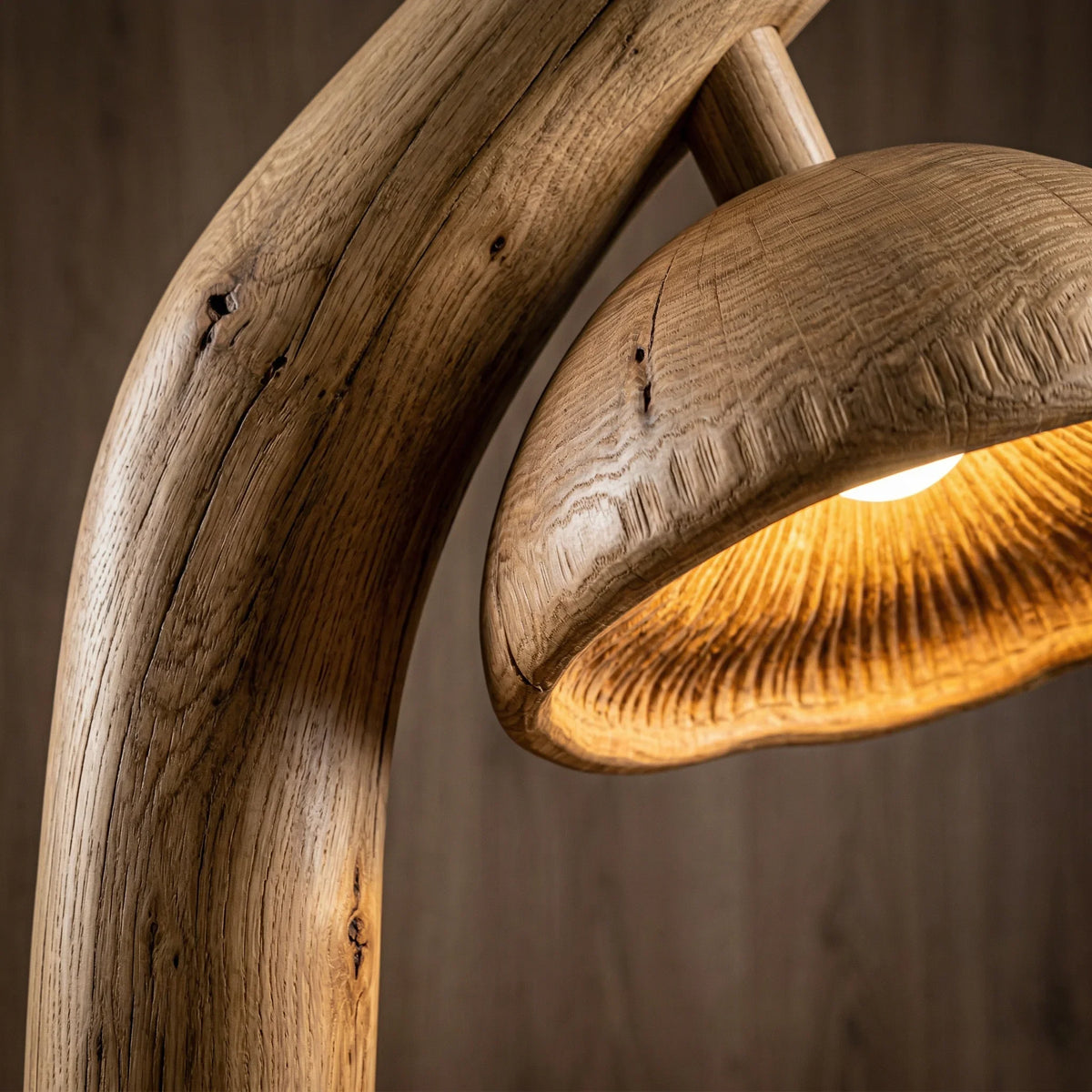 Natural wood mushroom-shaped floor lamp with sculpted log stem and glowing gill detail