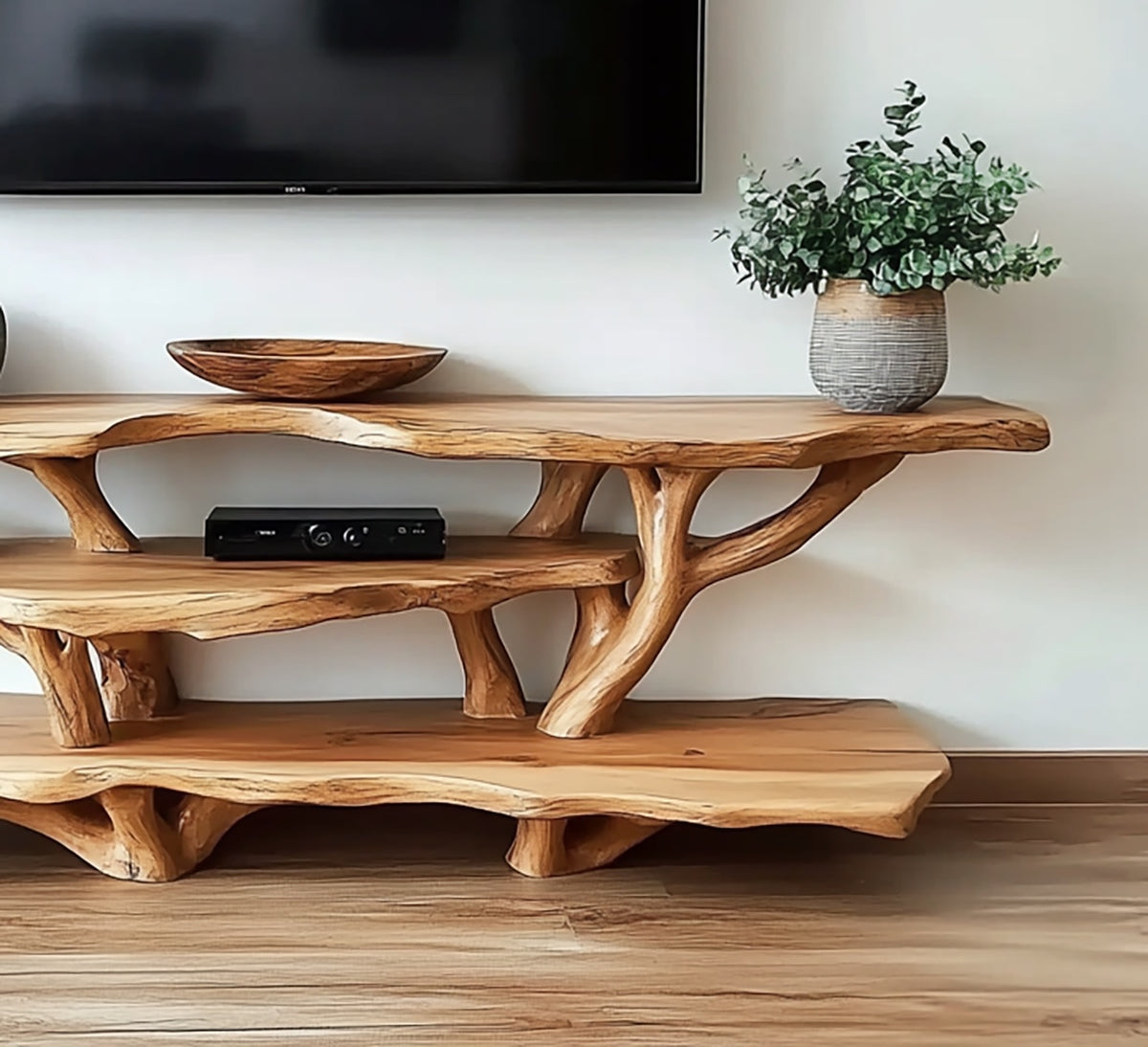Handcrafted live edge entertainment center featuring an artistic tree branch design
