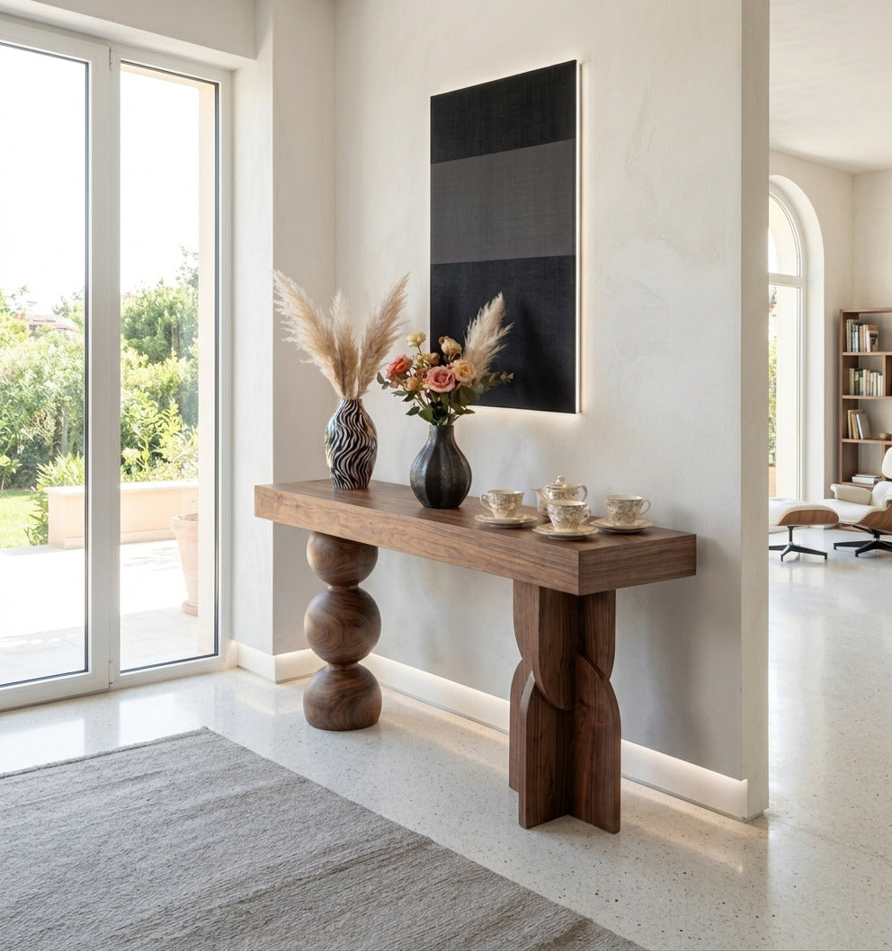 Organic sphere and curve solid wood console table in a modern entryway