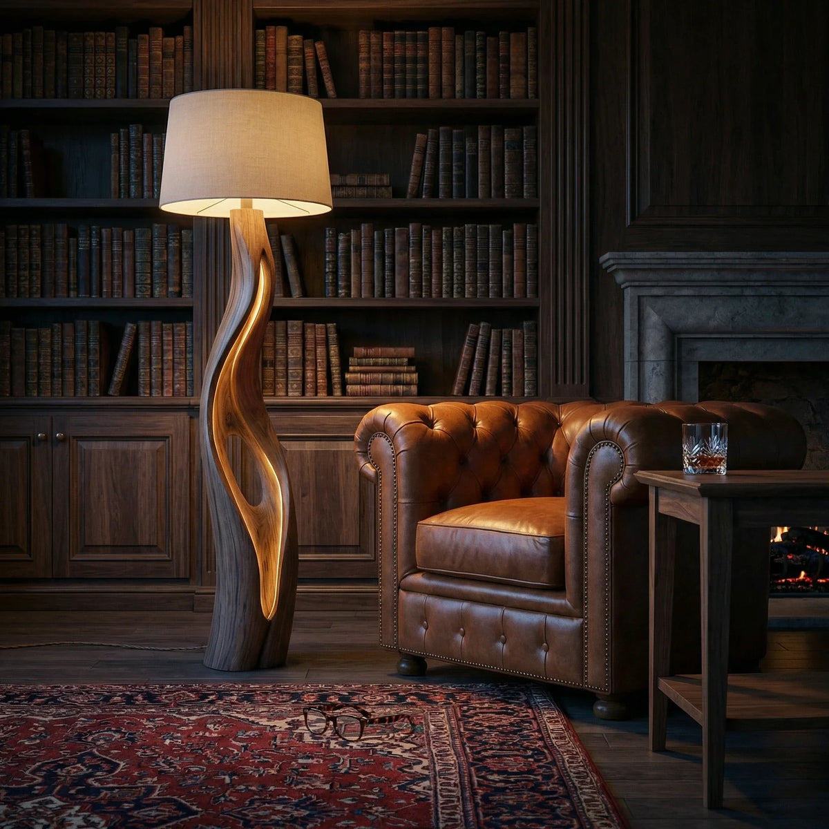 Organic sculpted wood floor lamp with inner glow beside leather armchair in cozy library