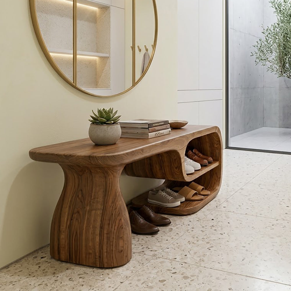 Sculptural asymmetric solid wood entryway shoe bench with integrated storage for modern entryways