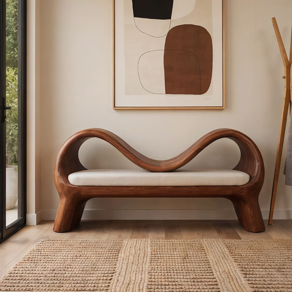 Sculptural solid wood double wave arch bench in a contemporary entryway
