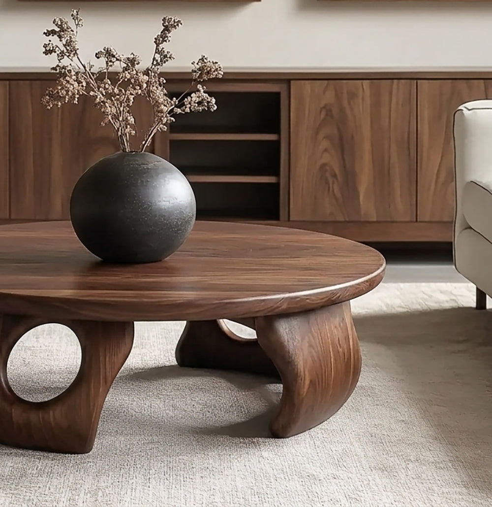 Organic modern coffee table featuring a handcrafted round design and natural wood grain
