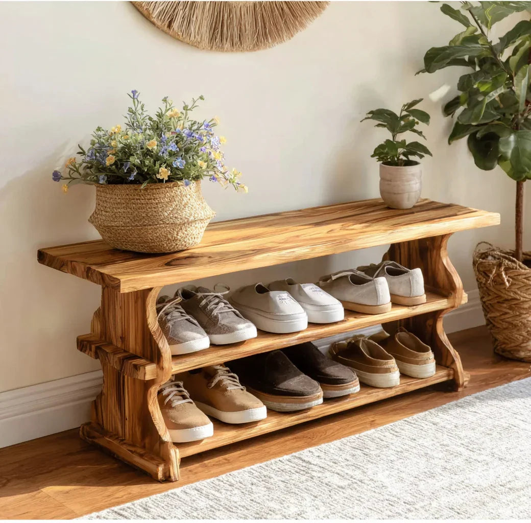 Solid wood entryway shoe bench with live edge design, shoe storage shelves, and plants