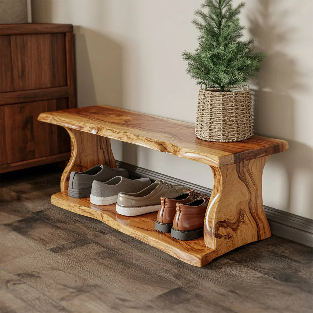 Solid wood shoe bench with natural grain, holding three pairs of shoes and a small pine plant in woven basket