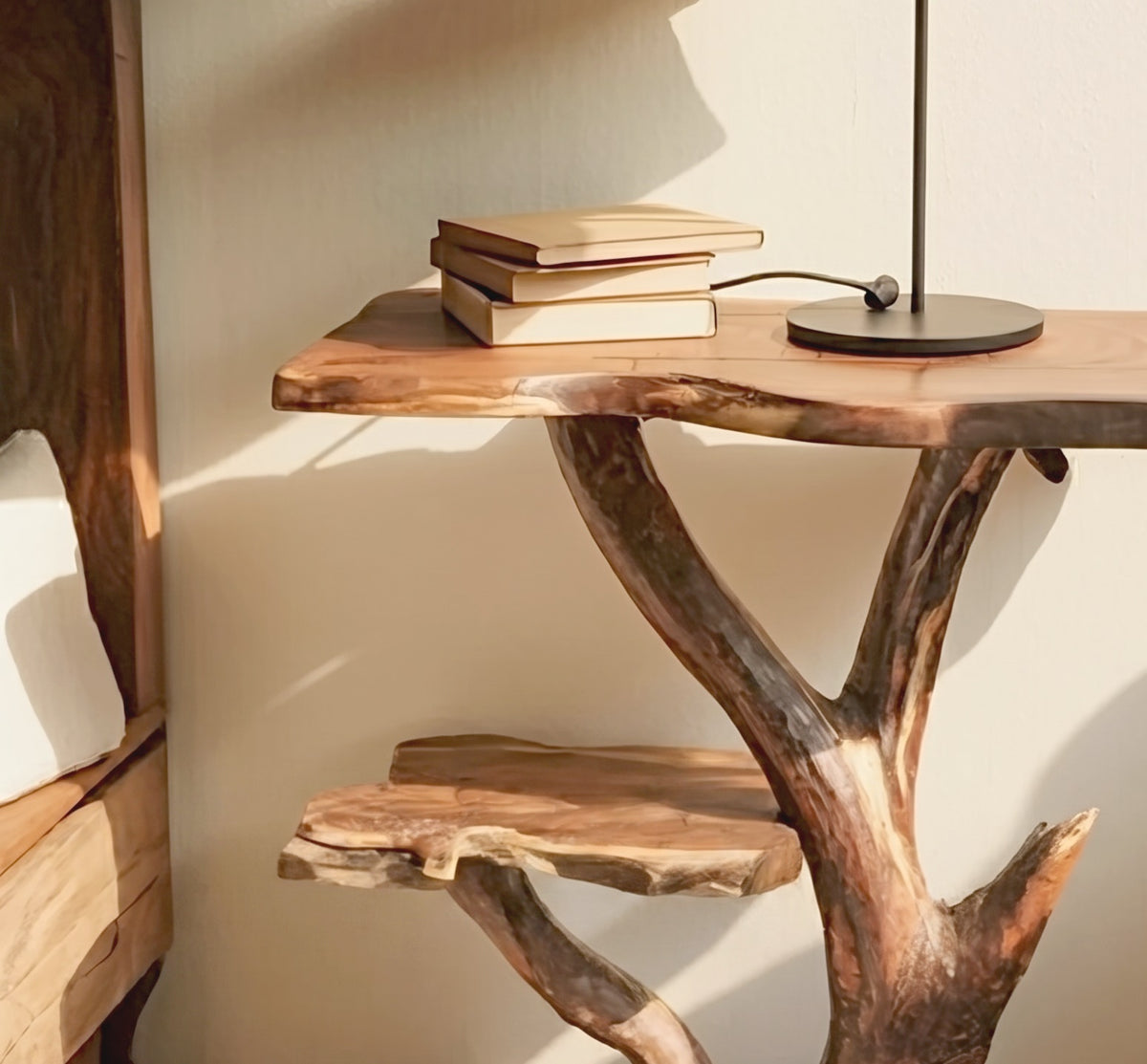 Organic live edge accent table featuring an artistic tree branch design
