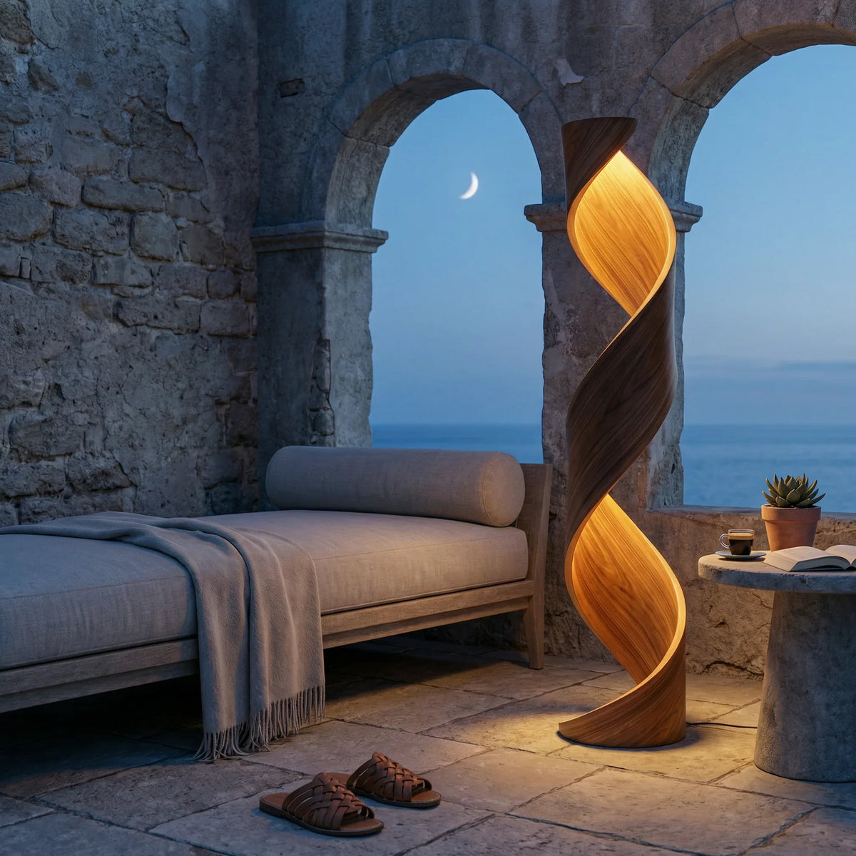 Twisted ribbon wood floor lamp with glowing light beside a lounge chair and ocean view.