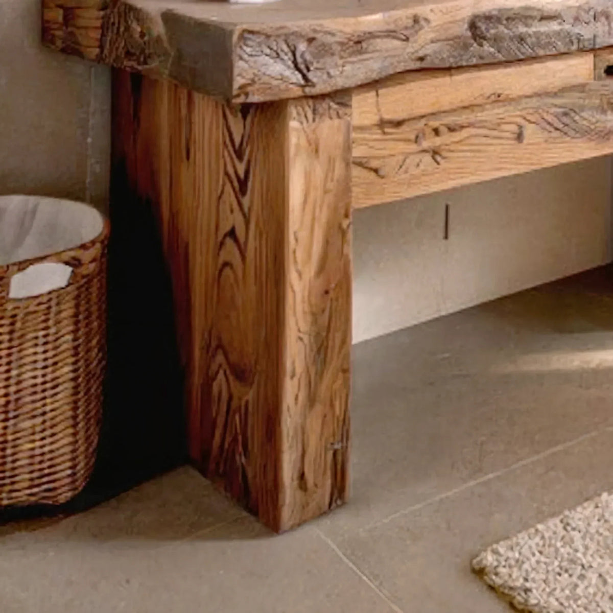 Close-up of a rustic live edge solid wood table with natural grain details.