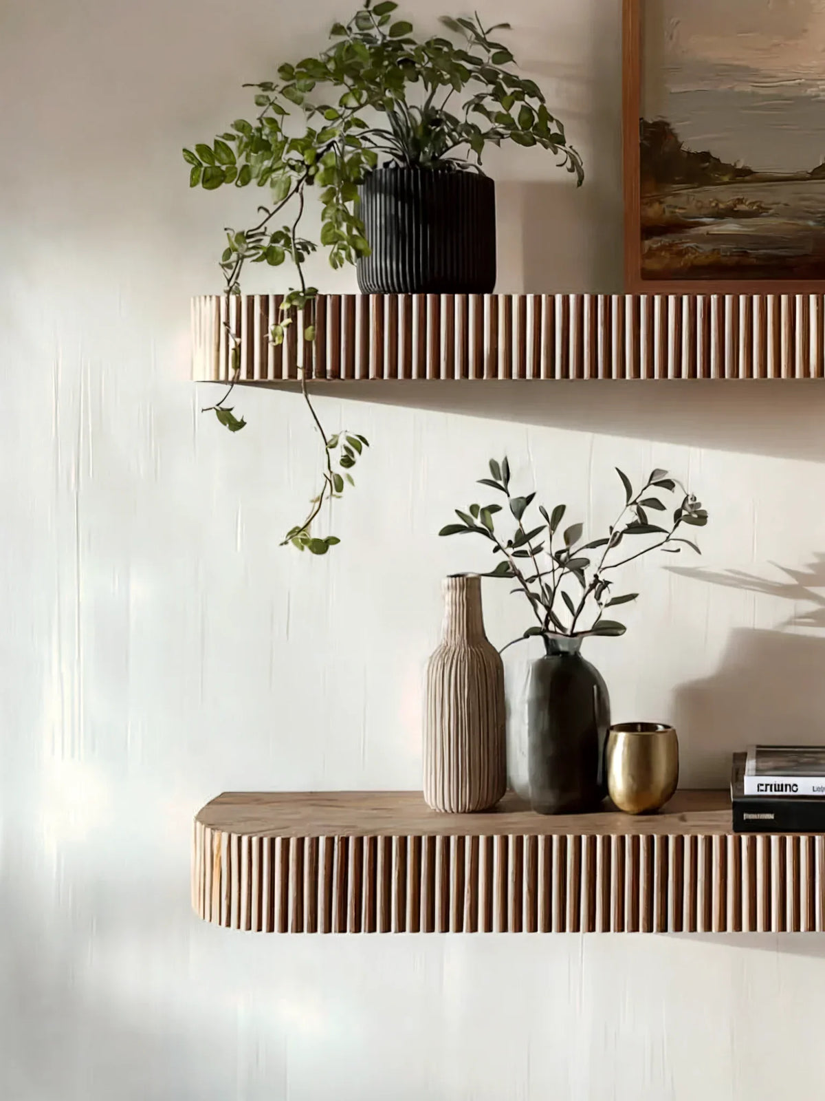 Modern interior with floating wood shelves, potted plants, ceramic vases, and books