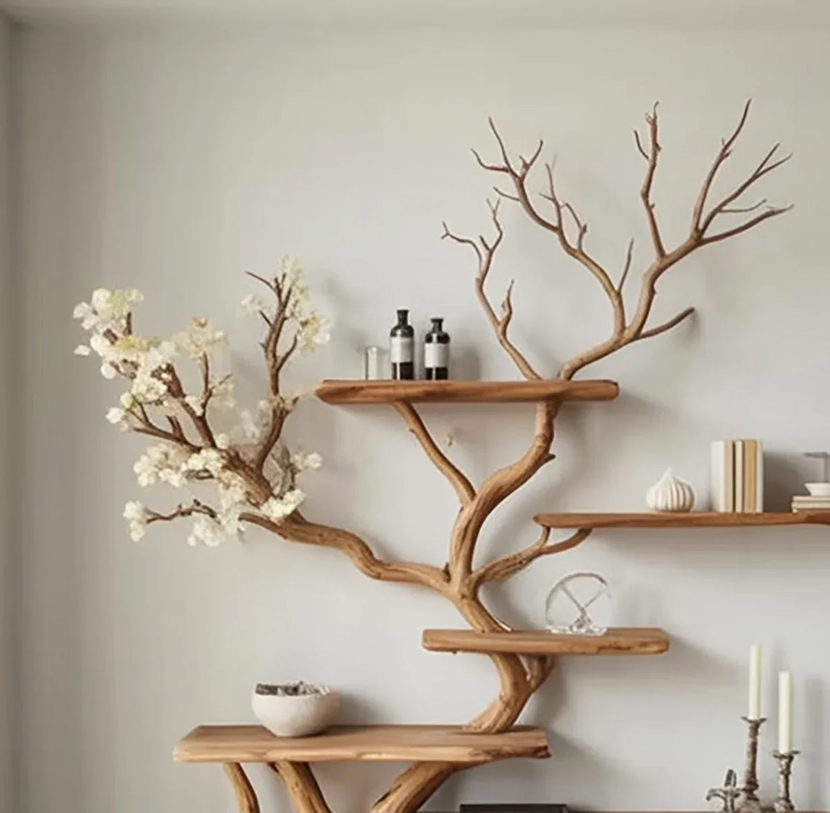 Live edge wooden tree bookshelf with branch shelves, decorative items, and minimalist decor