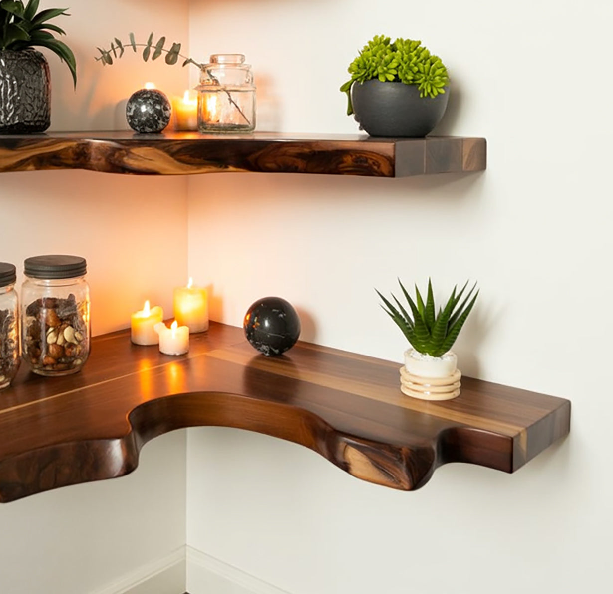 Live edge floating shelves with candles, potted plants, and decorative jars on a white wall.