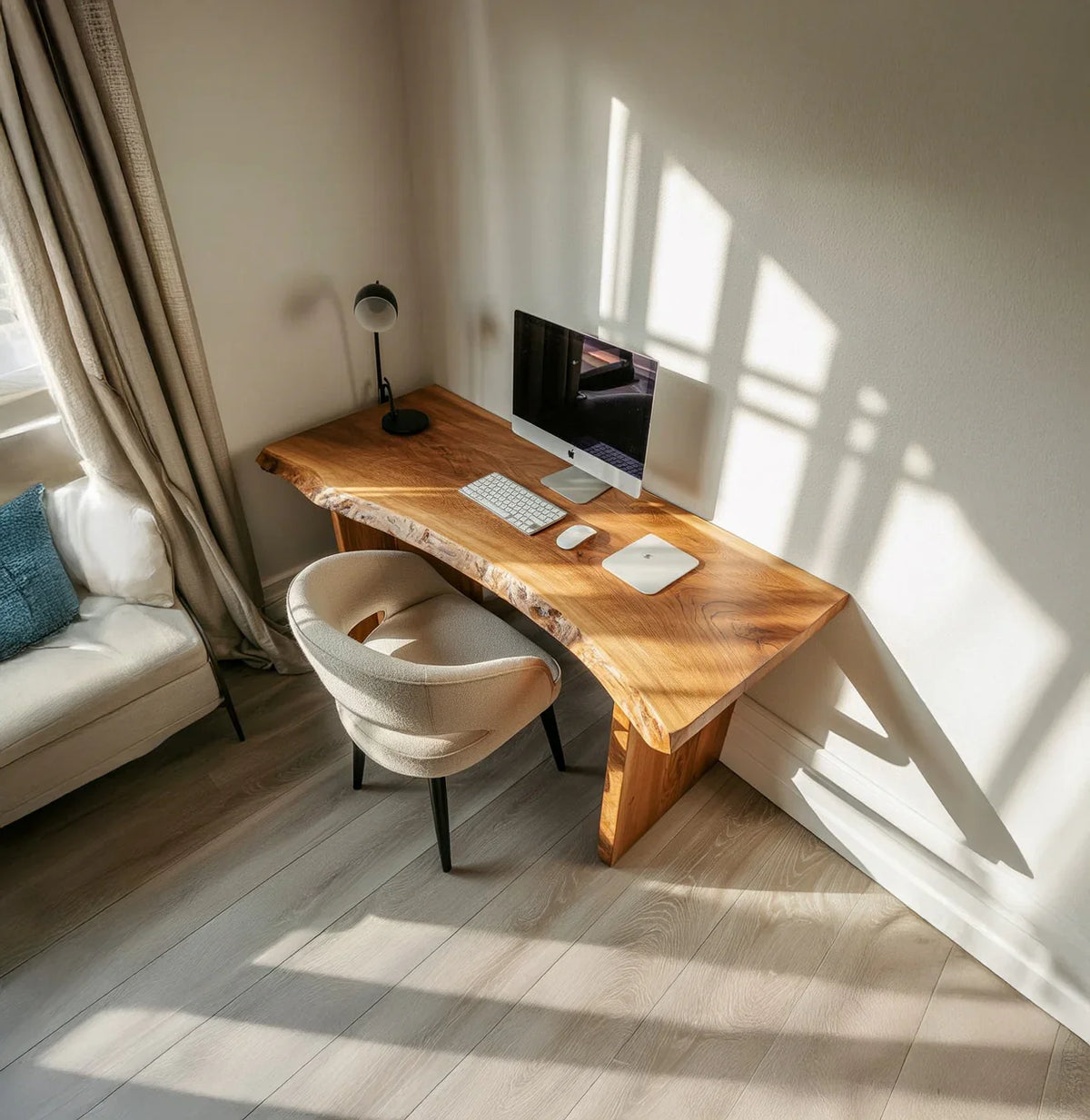 Modern home office with live edge solid wood desk, computer setup, and beige chair