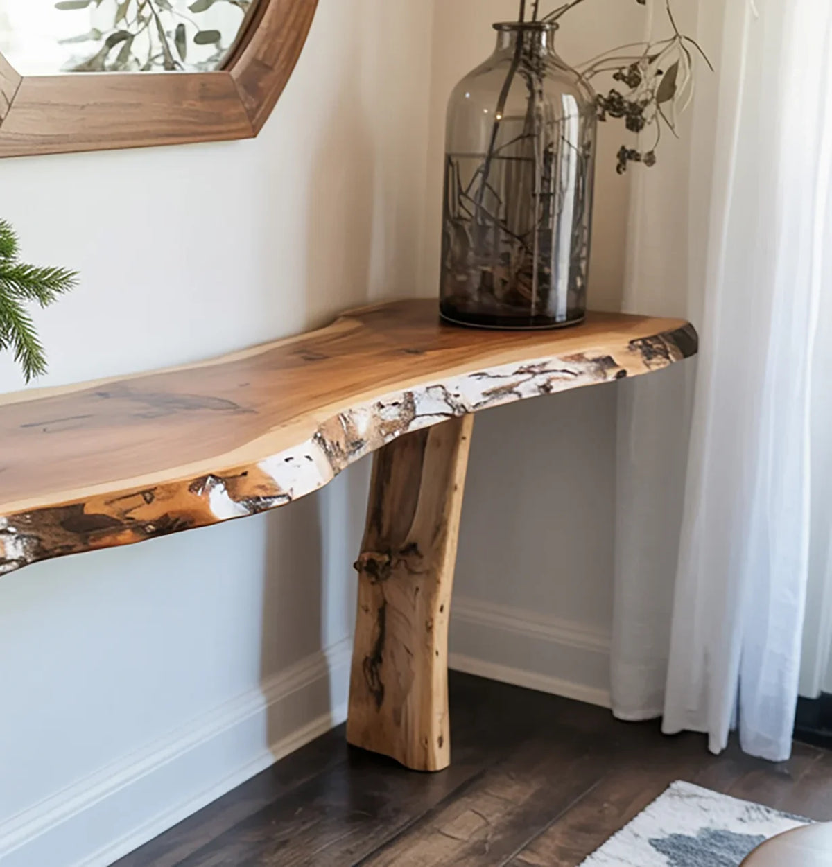 Live edge solid wood console table with natural finish in a bright, modern entryway.