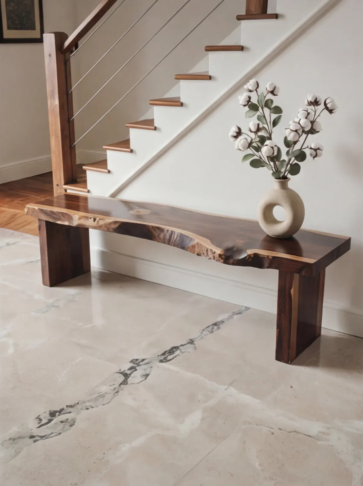 Live edge solid wood bench in hallway, minimalist decor with modern vase and cotton stems