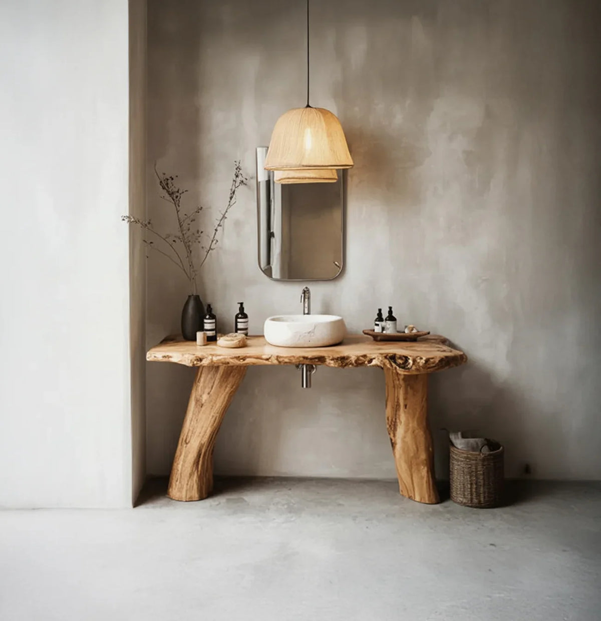 Live edge wood bathroom vanity with stone basin sink and modern decor in minimalist setting