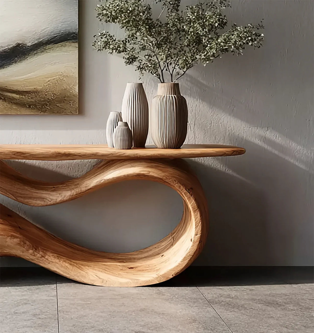 Curved wooden console table with textured ceramic vases and greenery against a textured wall