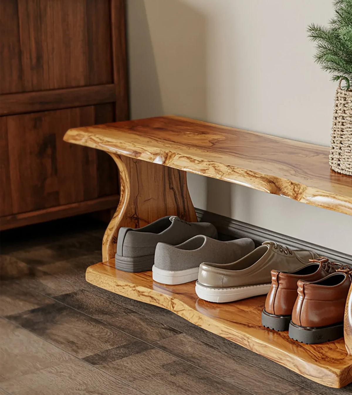 Wooden shoe bench with live edge design holding pairs of casual and leather shoes on dark hardwood floor