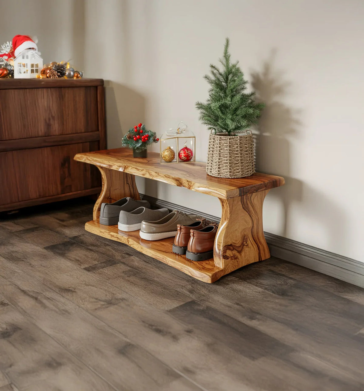 Wooden shoe bench with holiday decorations including mini Christmas tree and ornaments on top