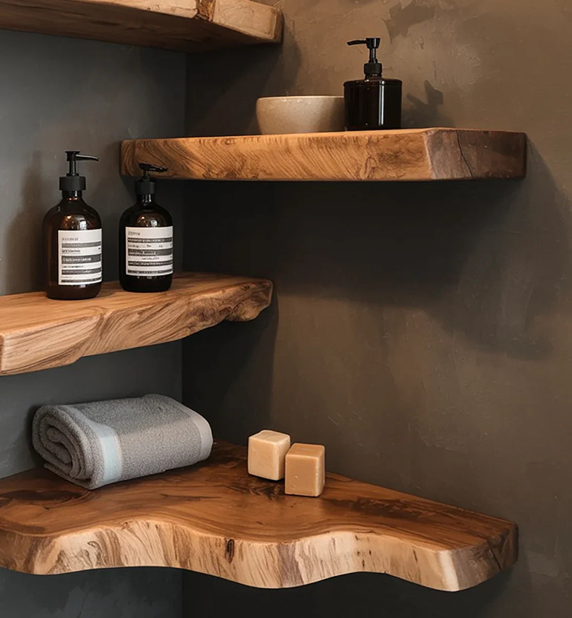 Modern bathroom shelves with natural live edge wood holding soap dispensers, soap bars, and a folded towel