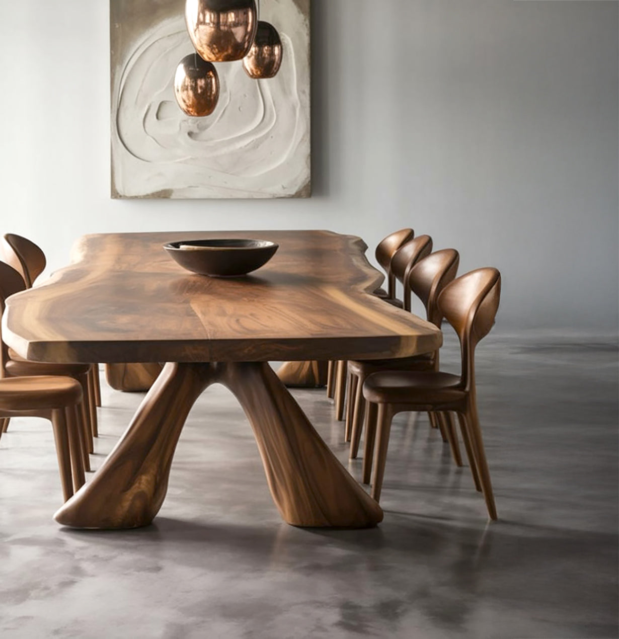 Modern dining room with live edge wooden table, matching chairs, copper pendant lights, and abstract wall art