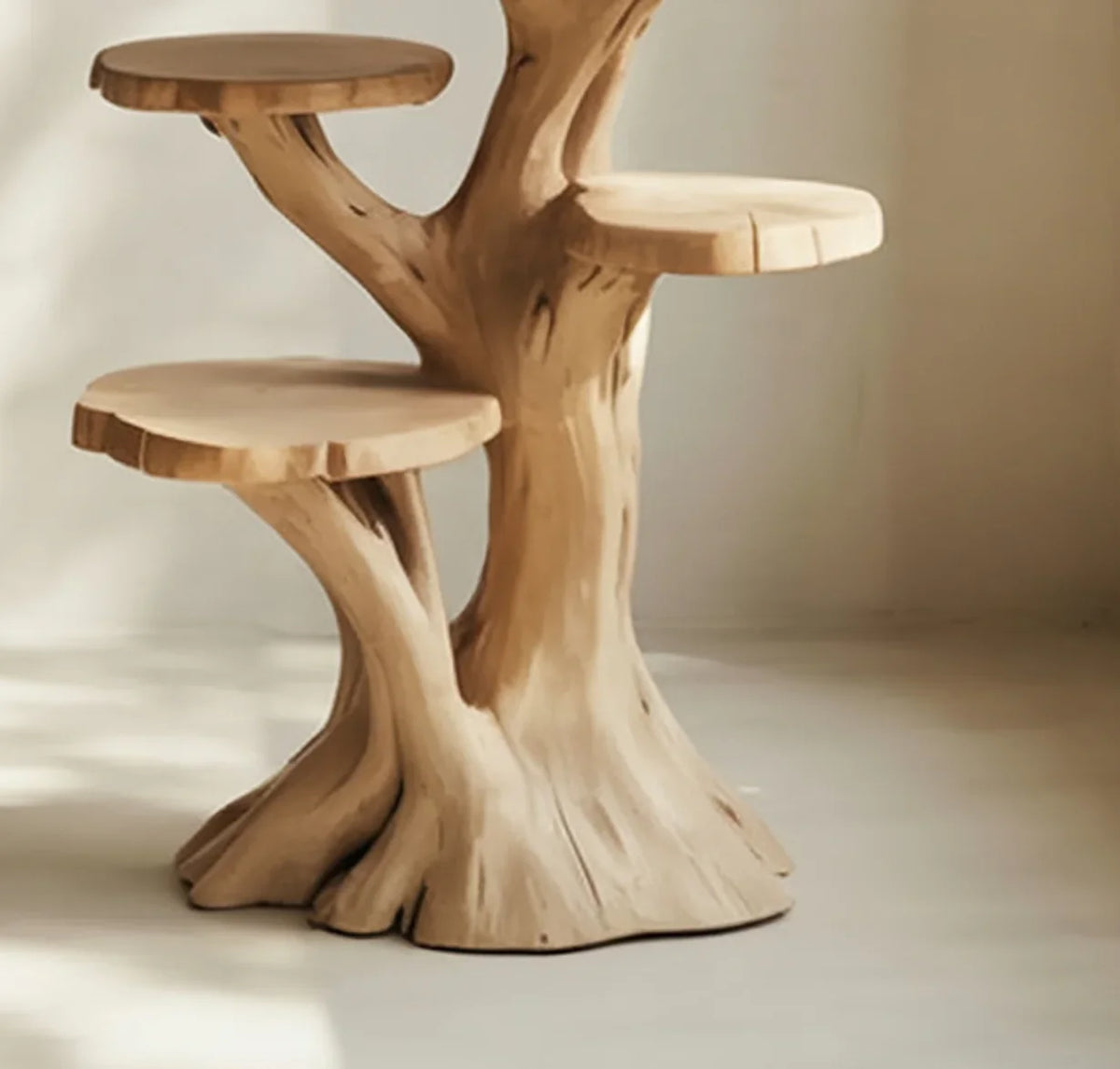 Solid wood tree-shaped bookshelf with three live edge shelves in natural light