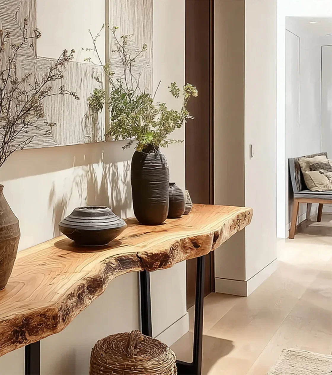 Live edge solid wood console table with ceramic vases in a modern hallway