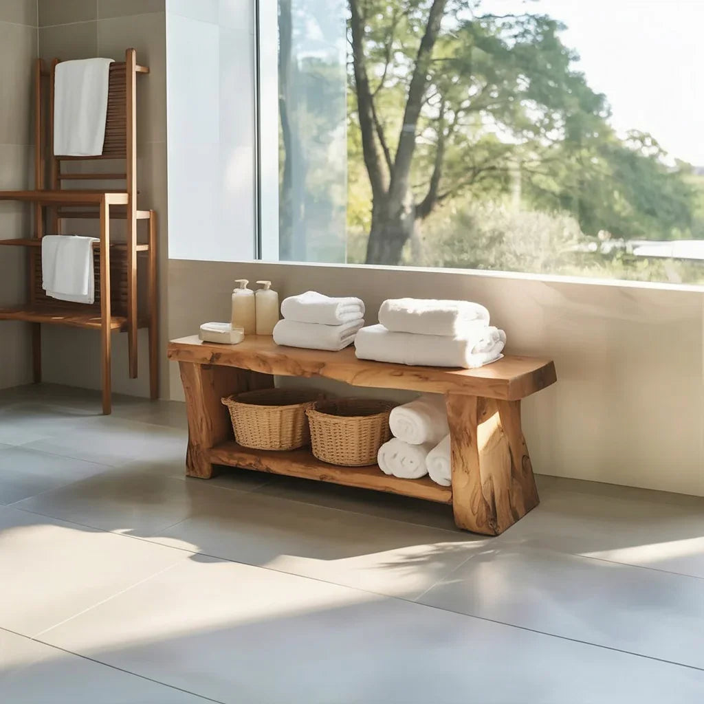 Solid wood live edge bench used as bathroom storage with towels and baskets, modern decor