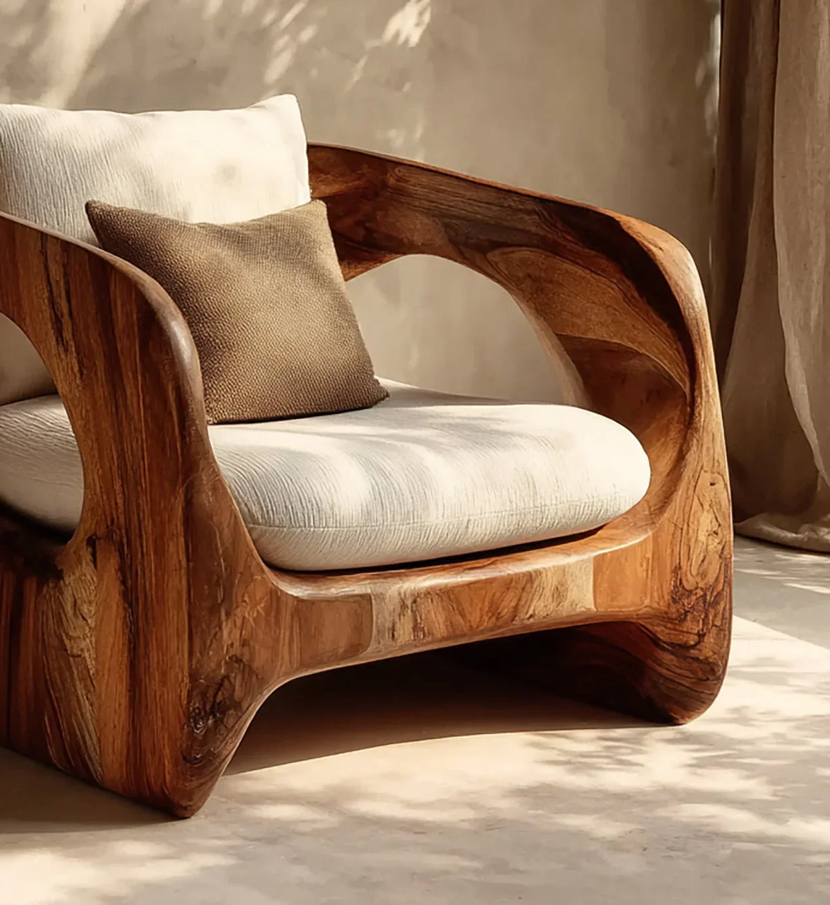 Sustainably crafted solid wood armchair with cream cushion and brown throw pillow