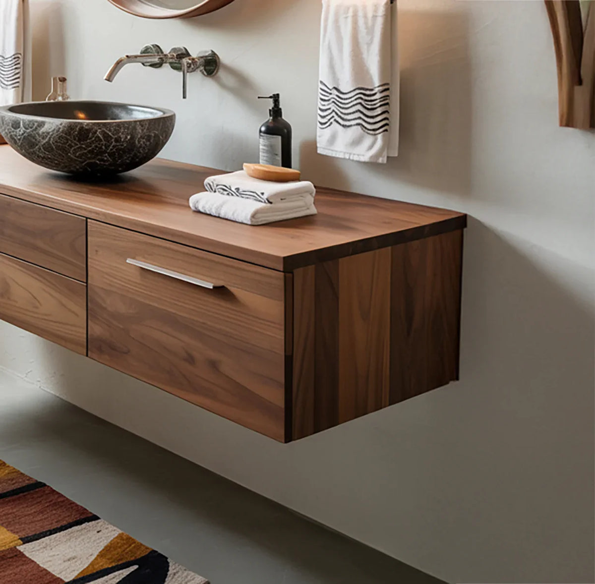 Modern bathroom with floating solid wood vanity, stone vessel sink, and elegant wall-mounted faucet