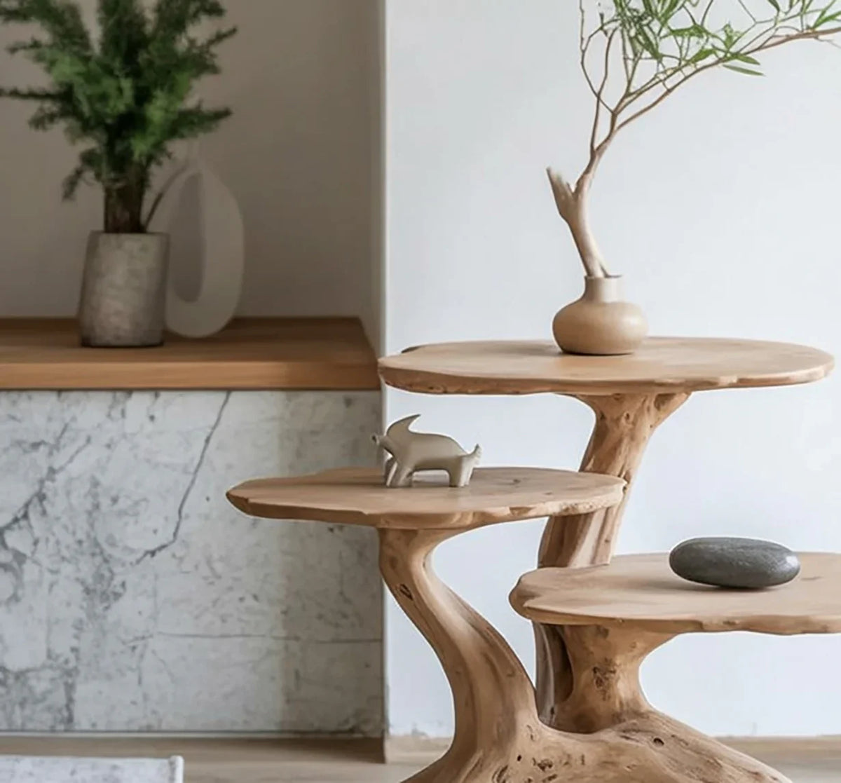 Live edge solid wood table with organic tiers, minimalist decor, and natural stone accent