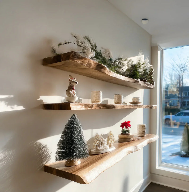 Live edge floating wooden shelves with festive holiday decor in sunlit room