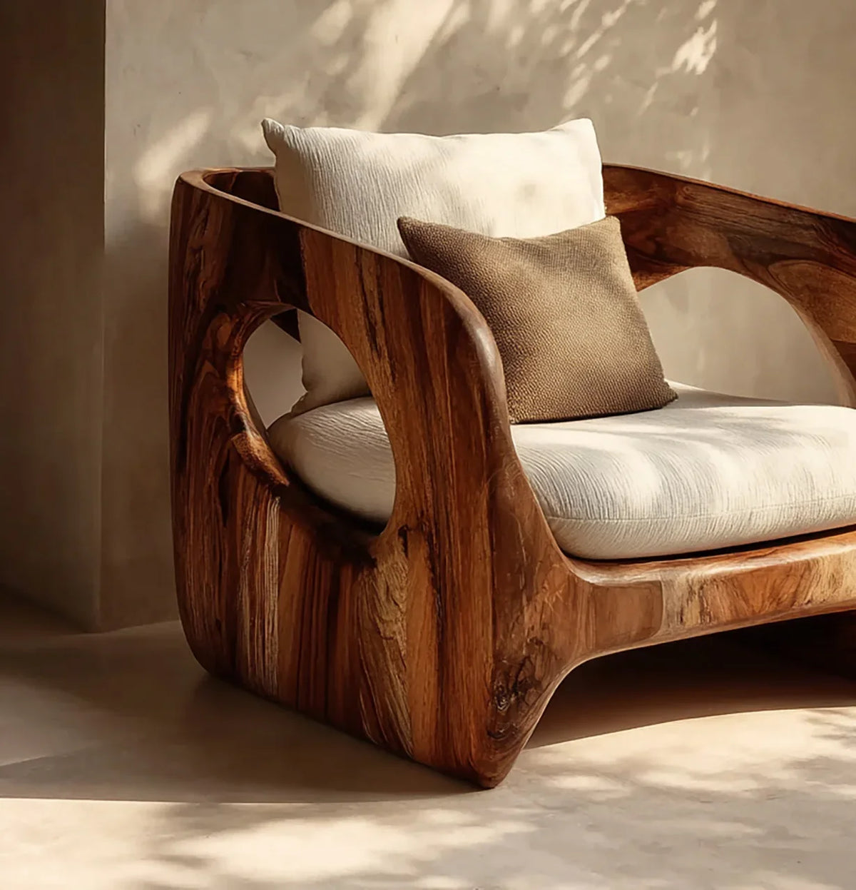Modern solid wood armchair with natural live edge and cream cushions in sunlit room