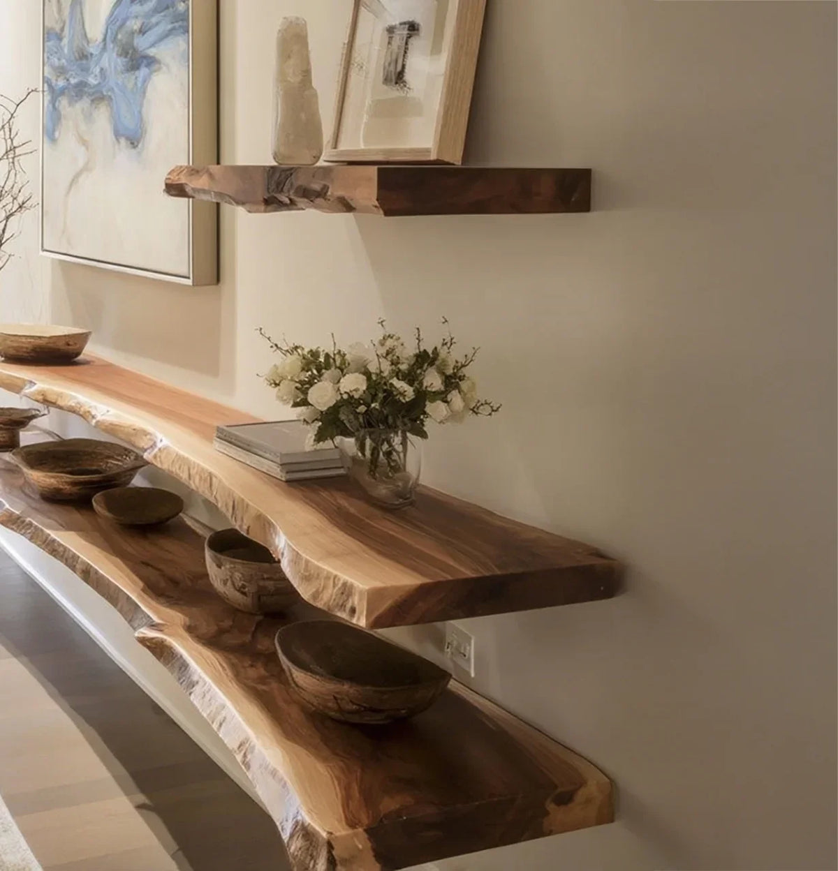 Natural live edge wooden shelves with decorative bowls and white flower vase in a modern interior