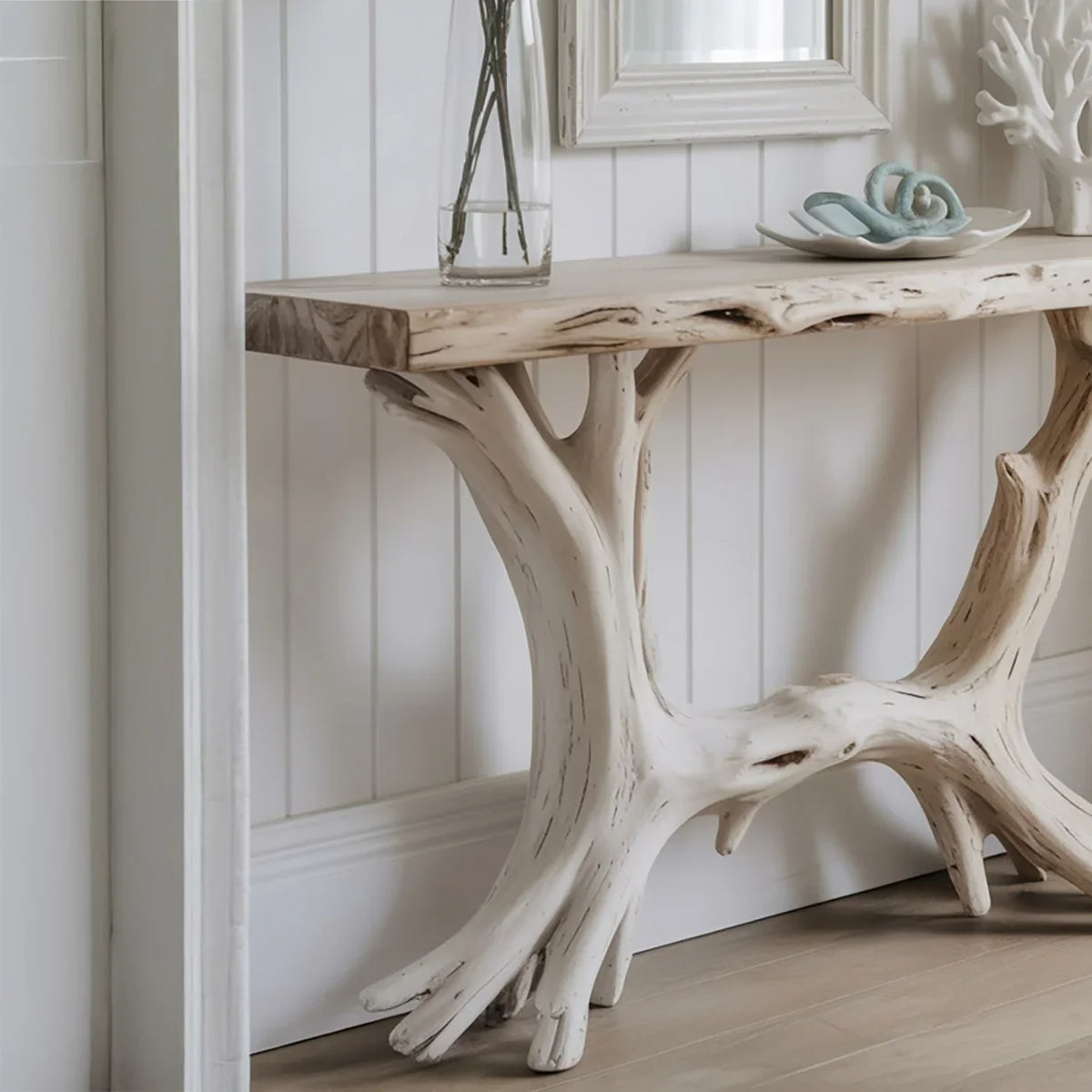 Live edge console table with natural wood branch legs in a modern entryway