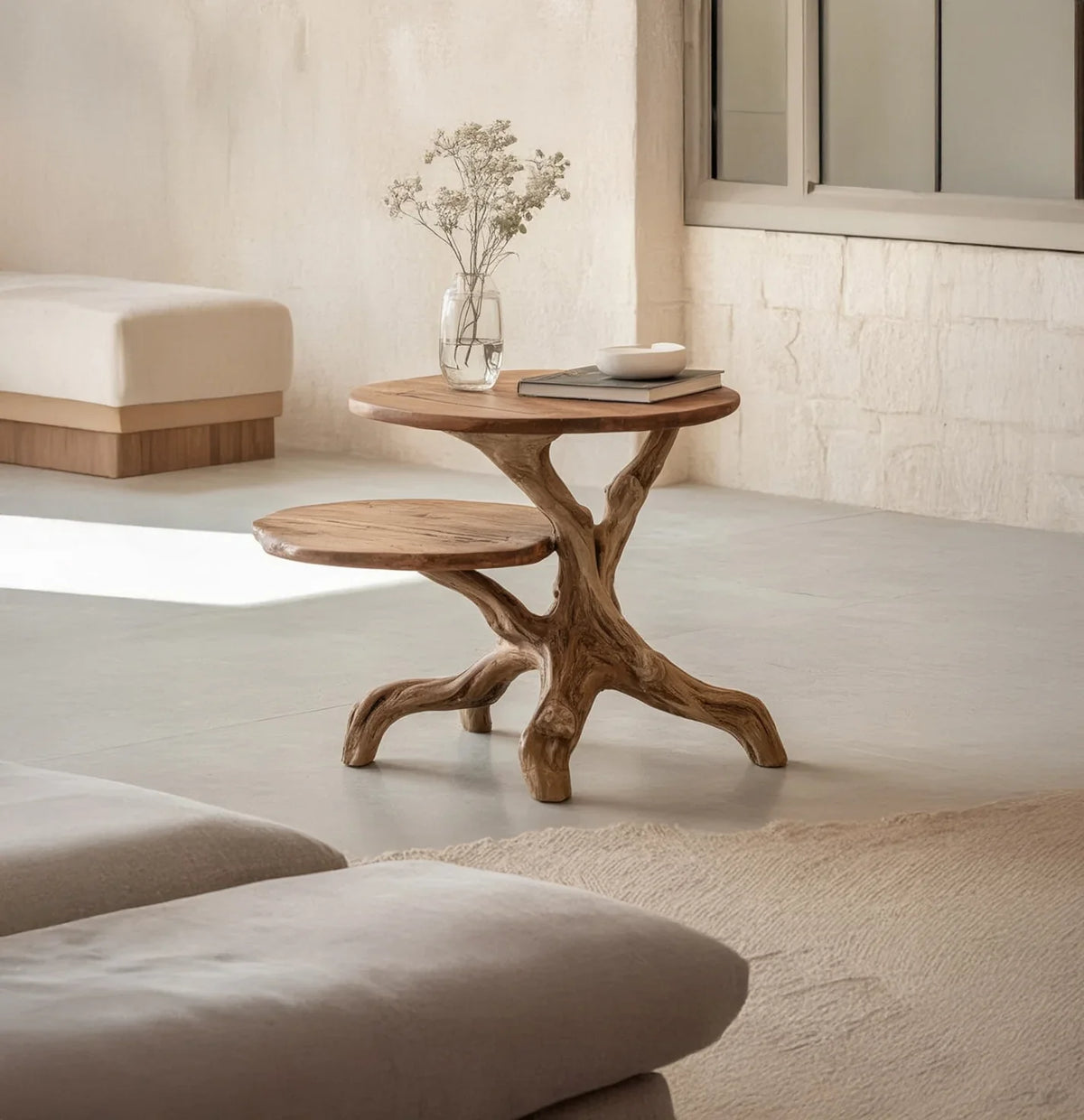 Live edge solid wood coffee table with sculpted branch base in modern minimalist living room