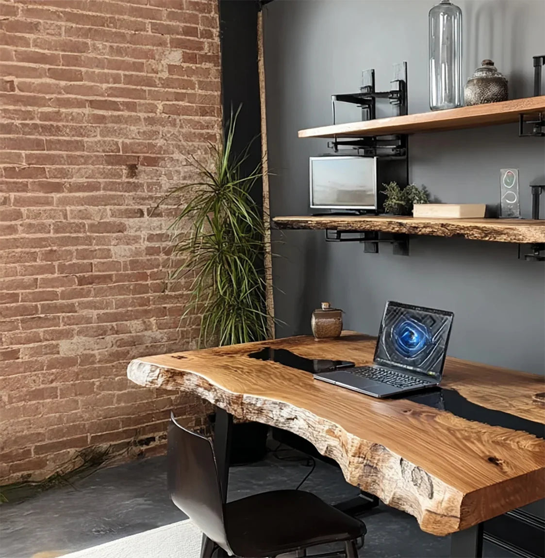 Modern office with live edge wood desk, laptop, brick wall, black chair, plants, and wooden shelves