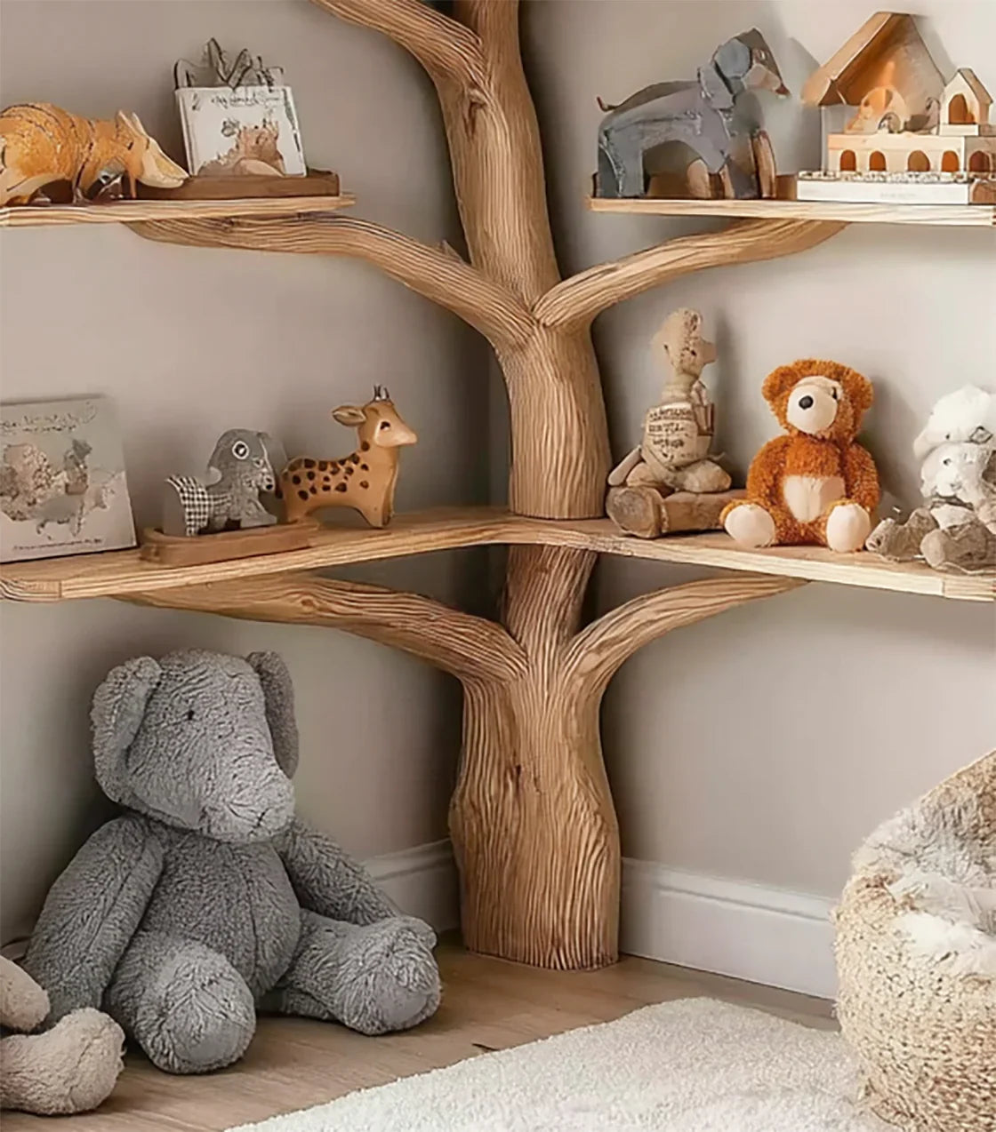 Wooden tree-shaped corner shelf with stuffed animals and animal figurines in a cozy nursery