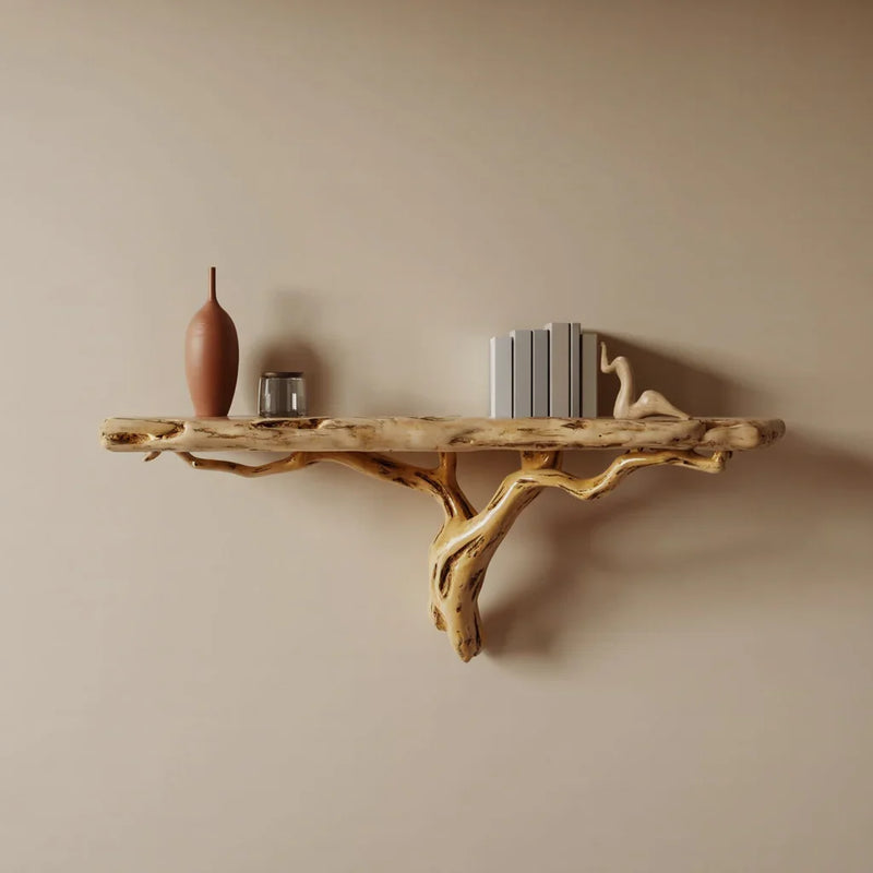 Live edge solid wood floating shelf with natural branch design holding vase, books, and decor.