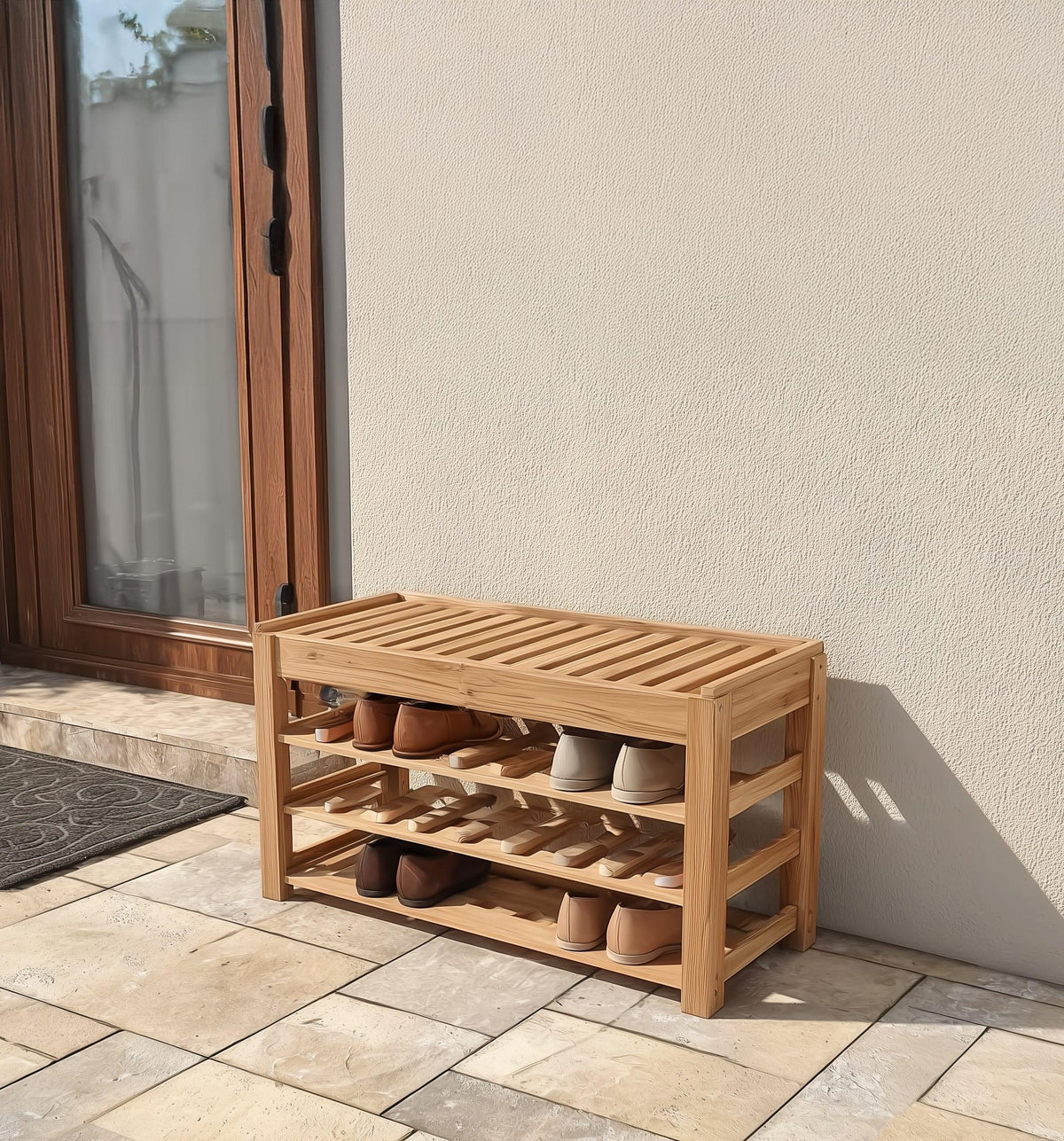 Solid wood shoe rack bench with slatted shelves holding shoes, placed outdoors by a wall