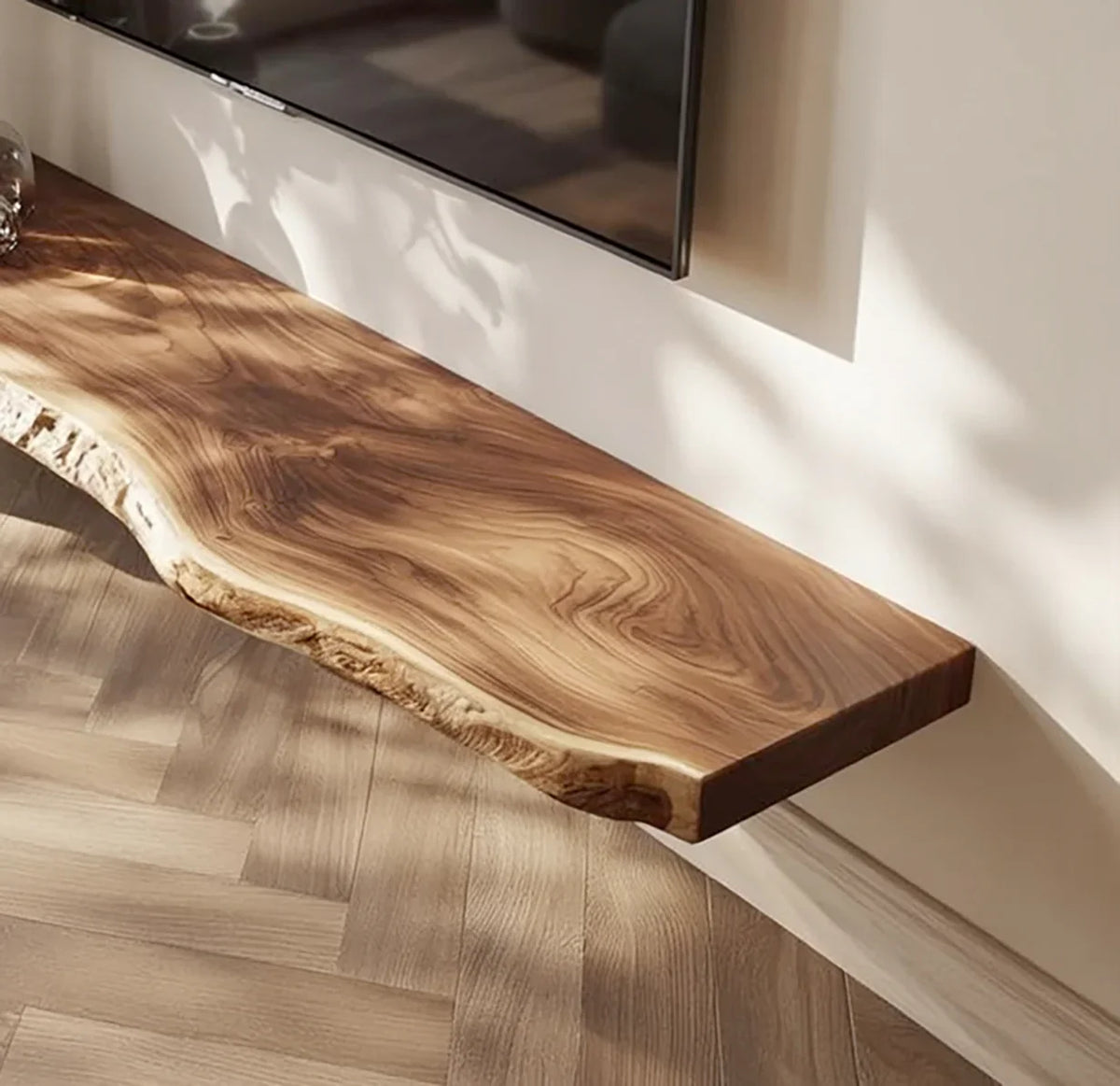Live edge solid wood floating shelf beneath wall-mounted TV in modern living room