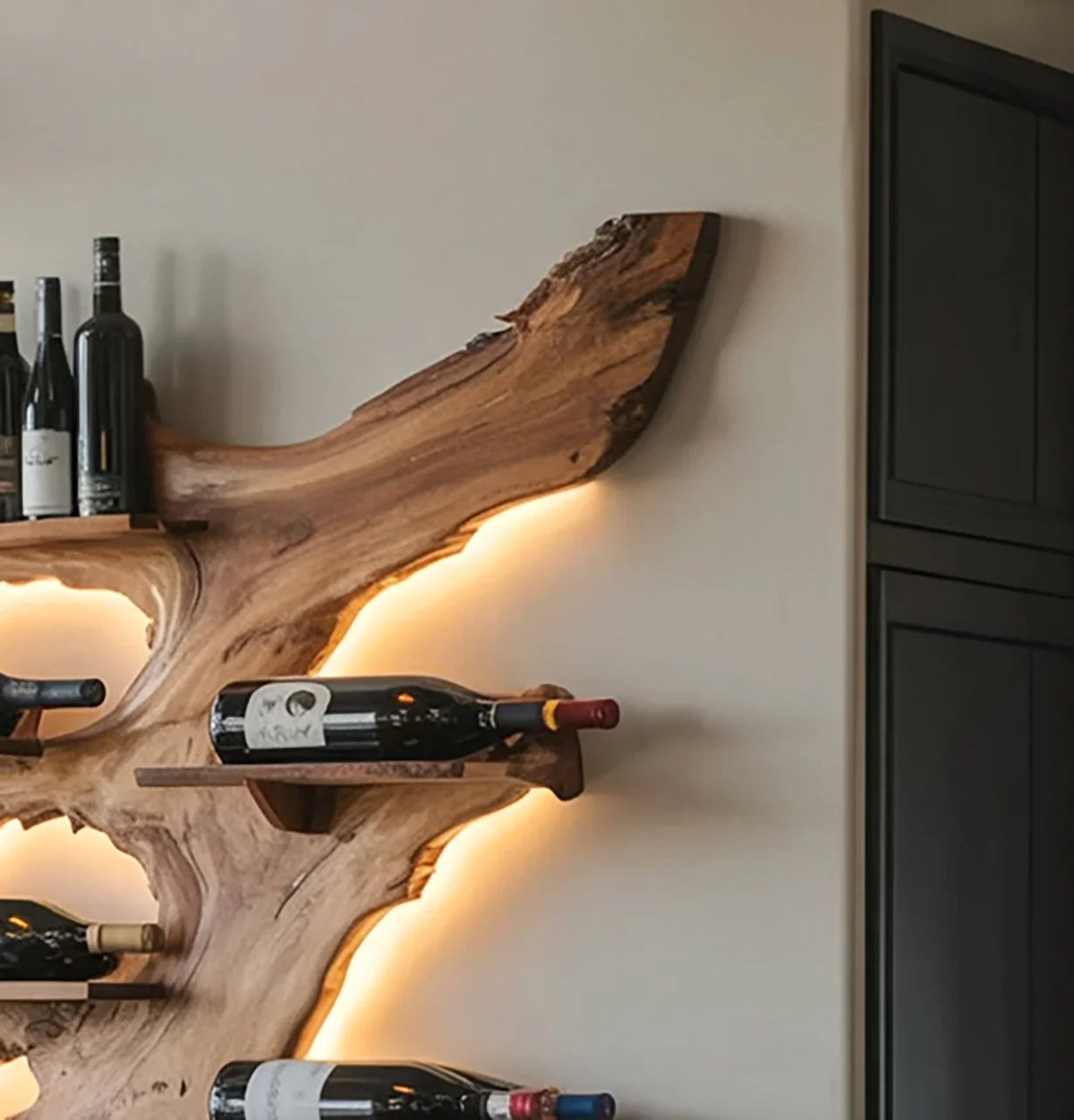 Wall-mounted natural wood wine rack with LED backlighting holding various wine bottles in modern interior