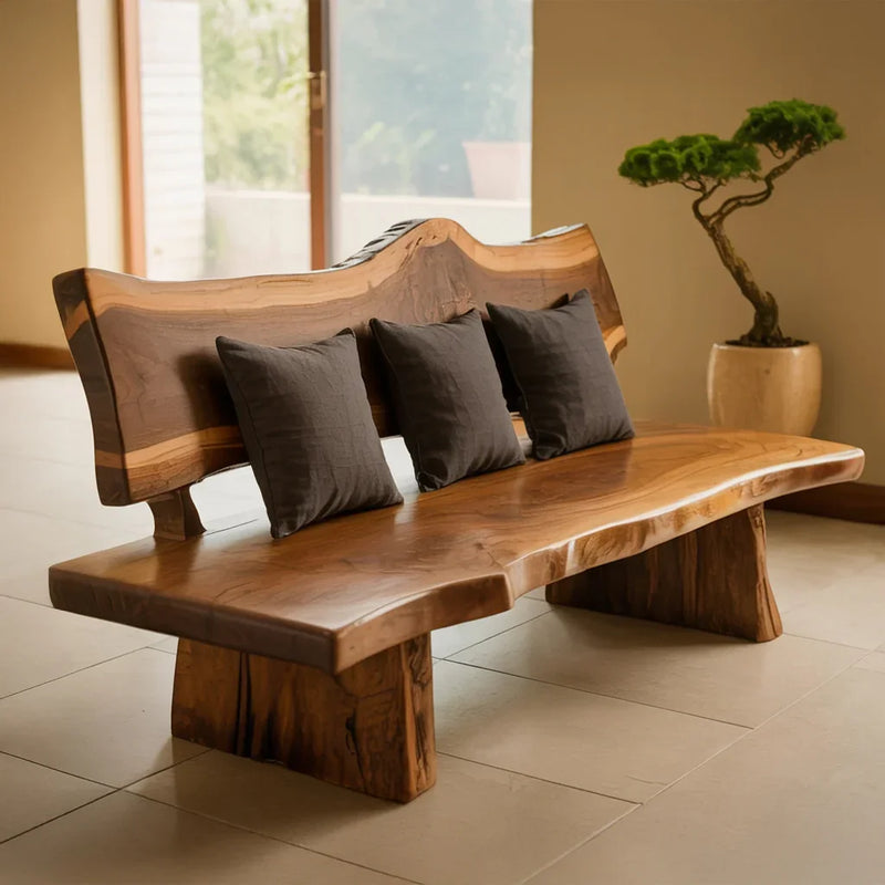 Live edge solid wood bench with black cushions in a modern, minimalist room