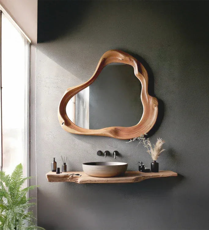 Live edge wood floating vanity shelf with vessel sink and organic-shaped mirror in modern bathroom